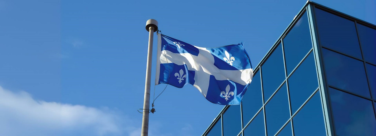 Quebec Flag next to a building